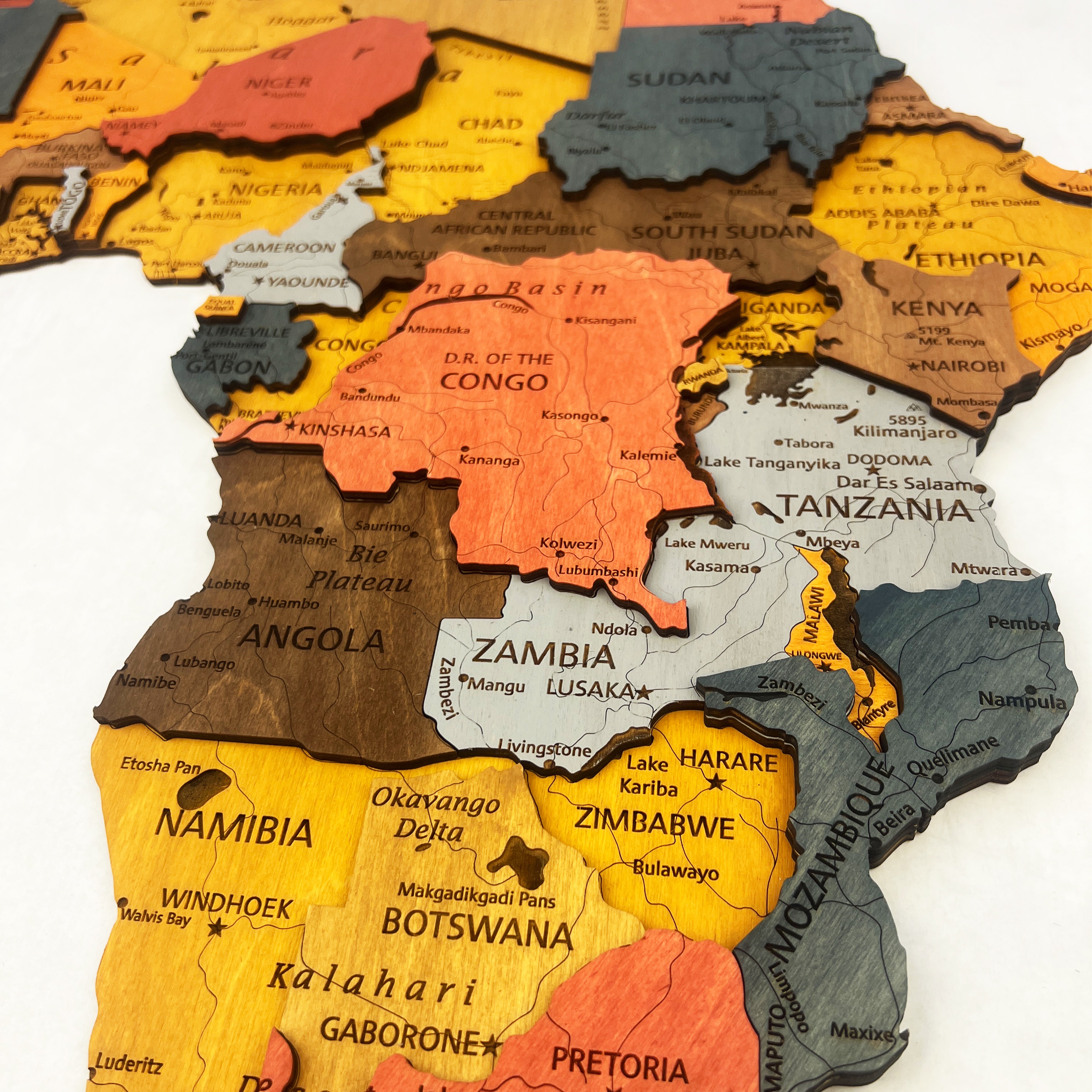 Wooden map of Africa with each country in a different color.