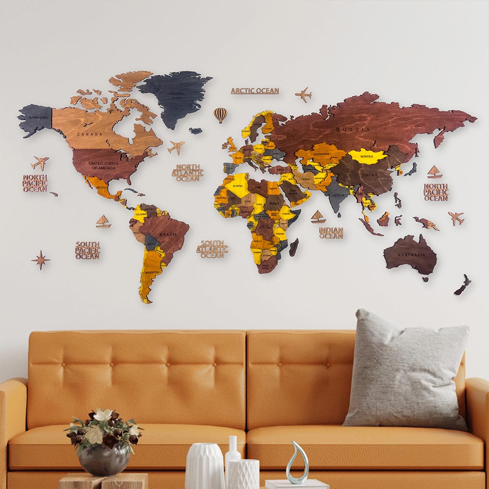 World map wall decoration in a living room with a brown sofa and decorative items.