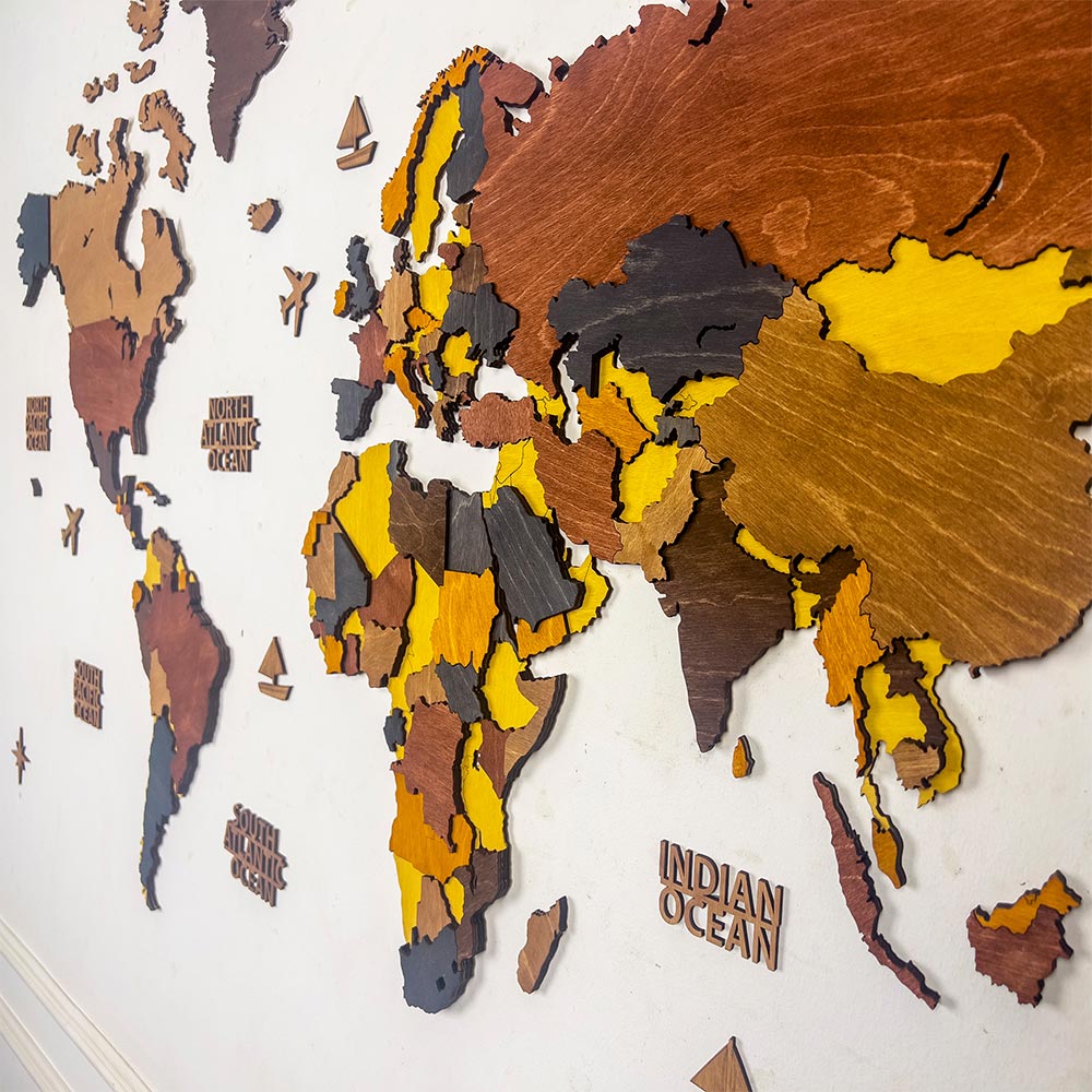 Wooden world map on a white wall