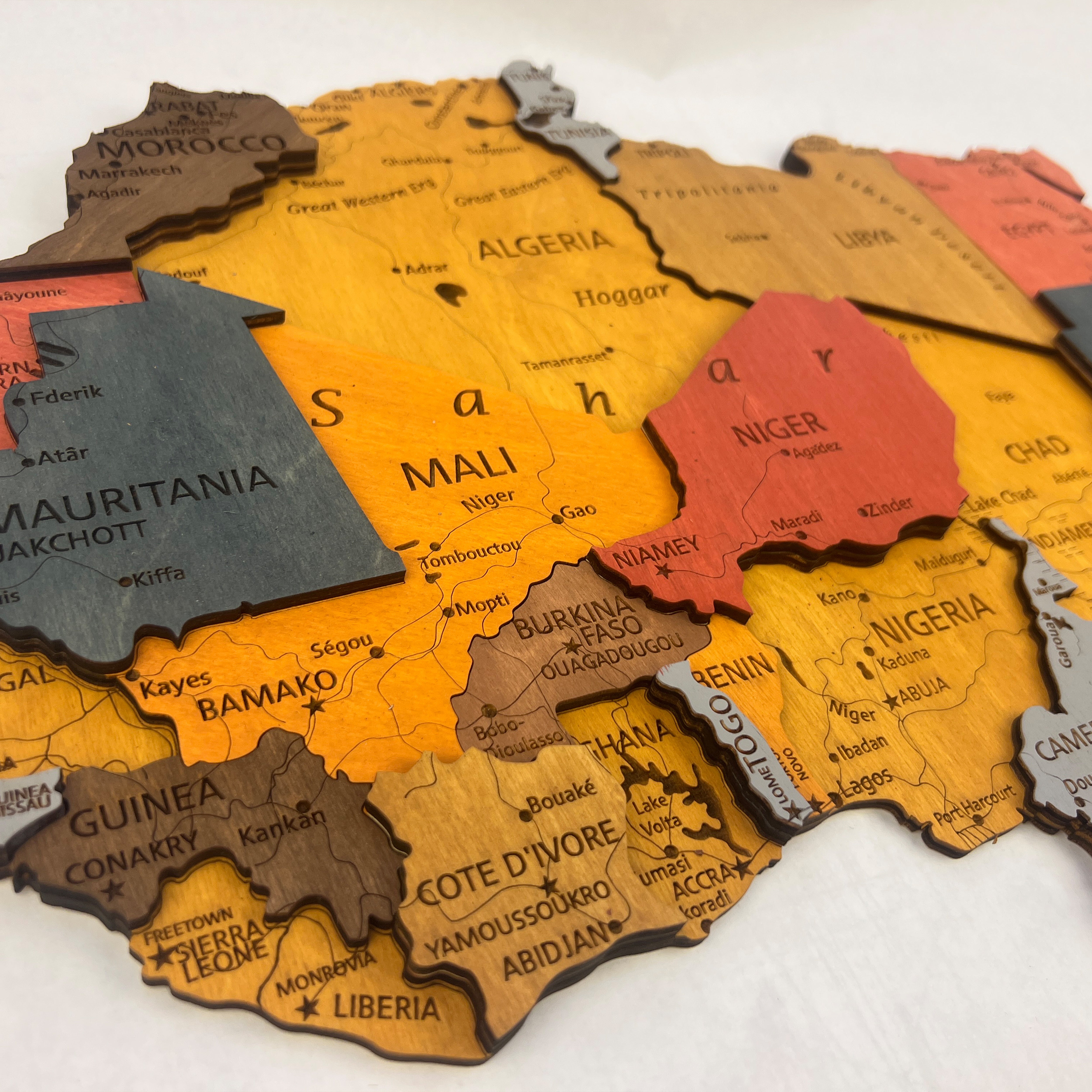 Wooden map of Africa with each country shaped like a puzzle piece.
