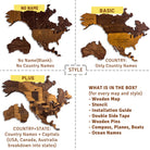 A product comparison graphic showing three wood-look map styles labeled No Name, Basic, and Plus, alongside a box of included items for every map and style. The maps are shown on a white background with dashed grid lines and text detailing country names and included accessories.