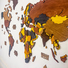 Wooden world map on a white wall
